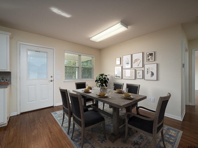 dining area featuring dark hardwood / wood-style floors