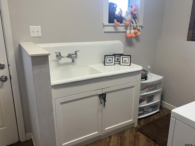 bathroom with wood-type flooring and sink