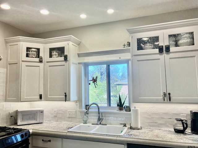 kitchen with sink and white cabinets