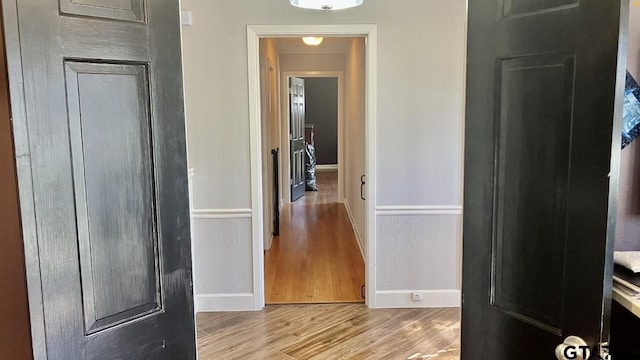 hall with light hardwood / wood-style floors