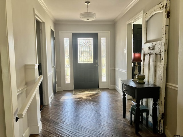 entryway featuring ornamental molding and dark hardwood / wood-style floors