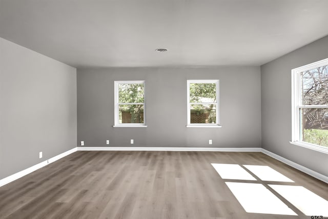 spare room featuring hardwood / wood-style flooring