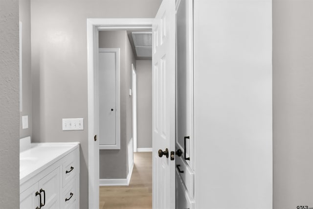 bathroom with hardwood / wood-style flooring and vanity