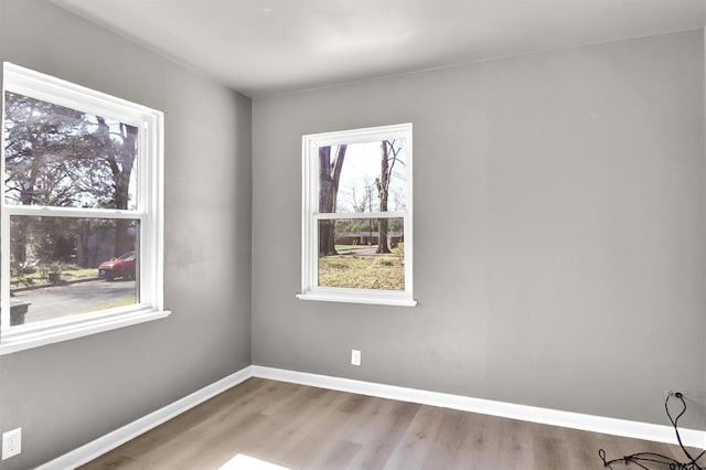 spare room featuring light wood-type flooring