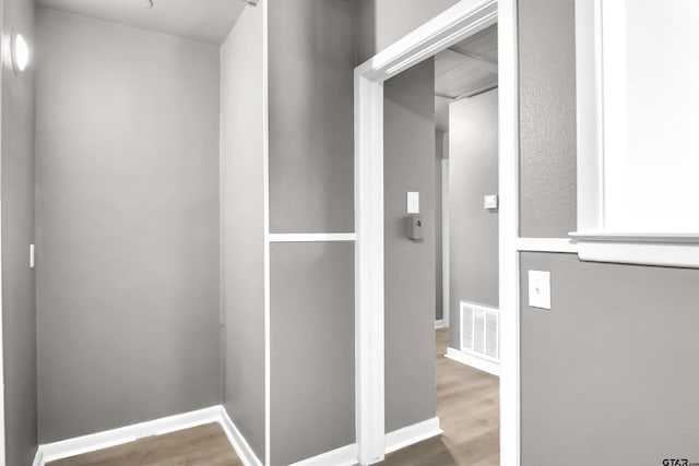 hallway featuring hardwood / wood-style flooring