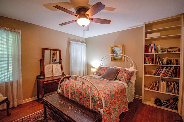 bedroom featuring ceiling fan and dark hardwood / wood-style floors