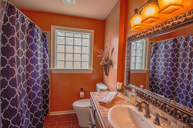 bathroom with vanity, tile patterned floors, and toilet