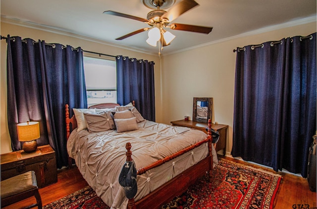 bedroom with crown molding, ceiling fan, and dark hardwood / wood-style floors