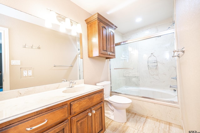 full bathroom with vanity, toilet, and combined bath / shower with glass door