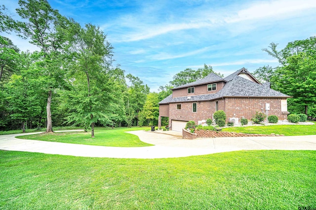 view of home's exterior featuring a garage and a yard