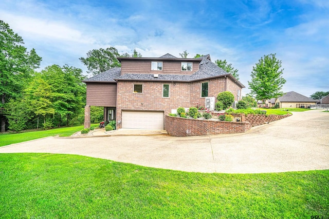 exterior space with a yard and a garage