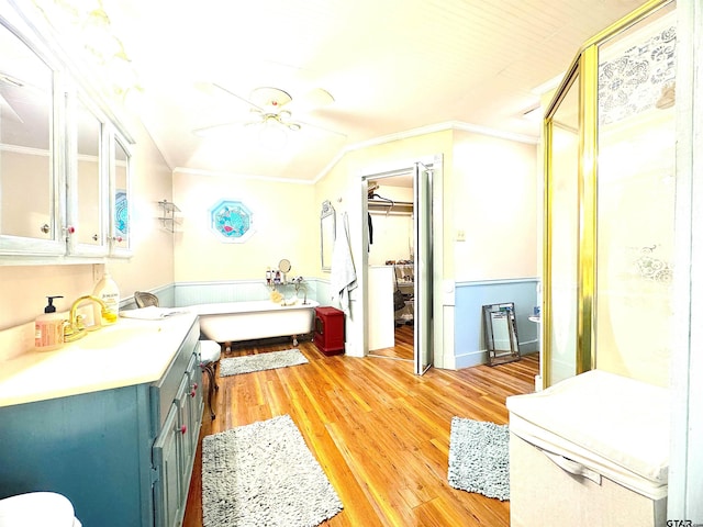 668 Omaha Dr, Omaha, TX 75571 - full bathroom featuring ornamental molding, ceiling fan, a bath, vanity, and a shower stall