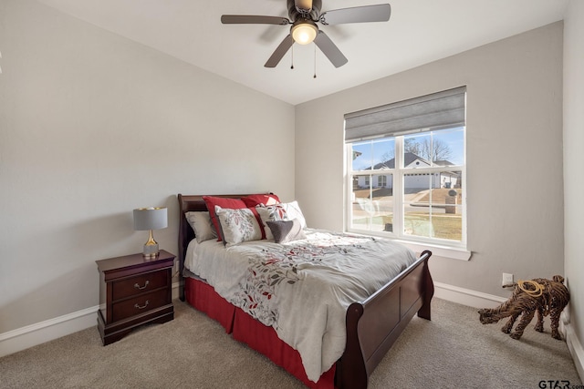 carpeted bedroom featuring a ceiling fan and baseboards