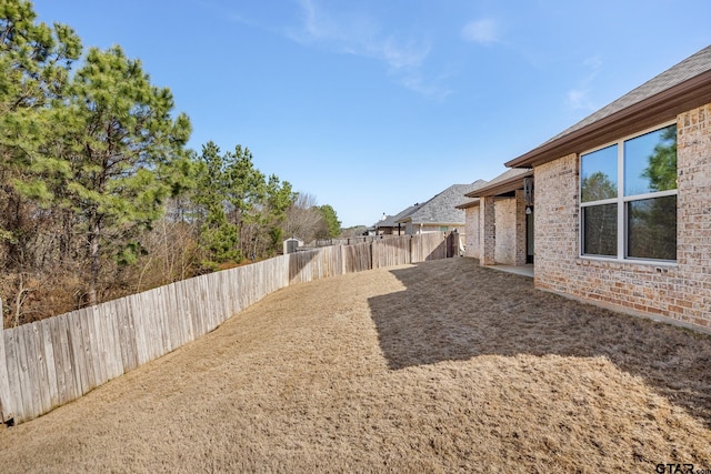 view of yard with a patio and a fenced backyard