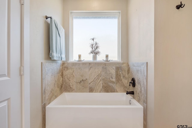 bathroom with a garden tub