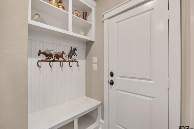 mudroom featuring a textured wall