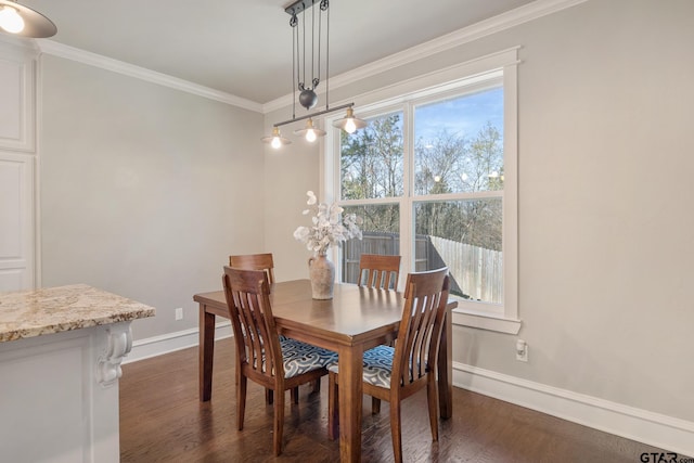 dining space with dark wood finished floors, a healthy amount of sunlight, crown molding, and baseboards