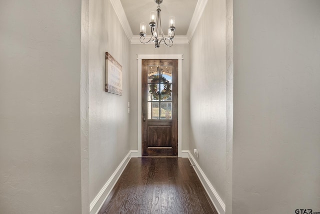 doorway to outside with baseboards, a chandelier, wood finished floors, ornamental molding, and a textured wall