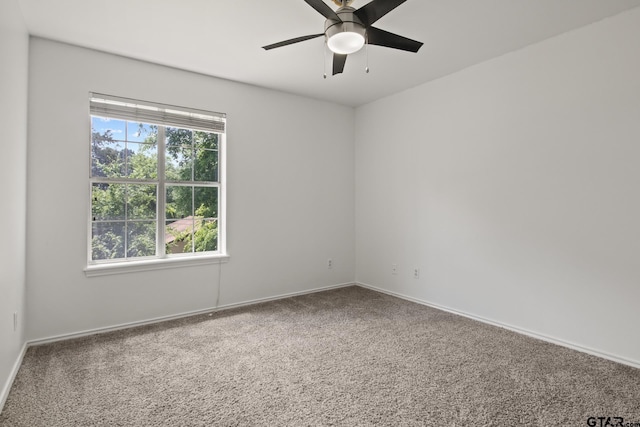 501 Morning Glory Cir, Hughes Springs, TX 75656 - carpeted spare room with baseboards and a ceiling fan
