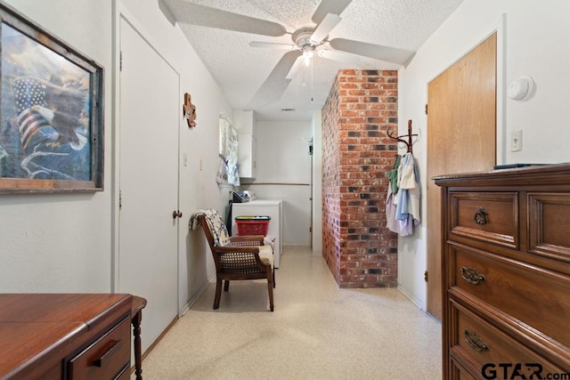 living area featuring light colored carpet, a textured ceiling, and ceiling fan