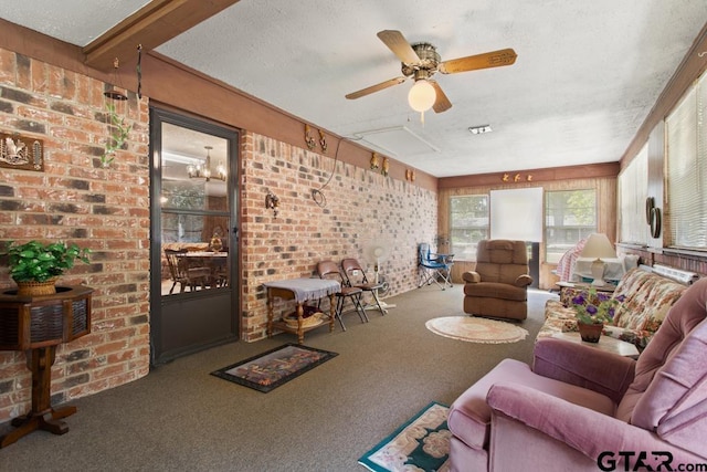 living room with a textured ceiling, carpet floors, ceiling fan, and brick wall