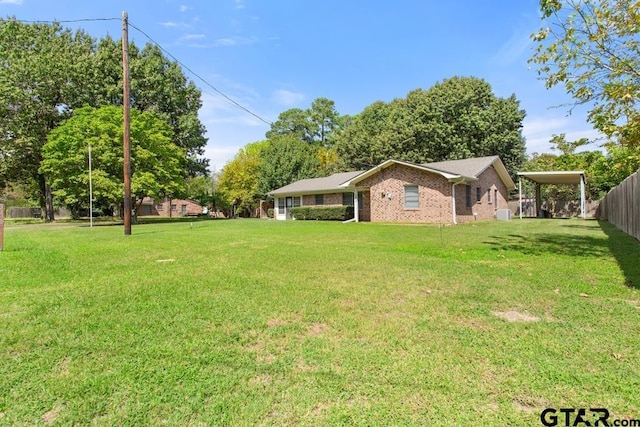 21187 Kristen Dr, Chandler, TX 75758 - view of yard with a carport