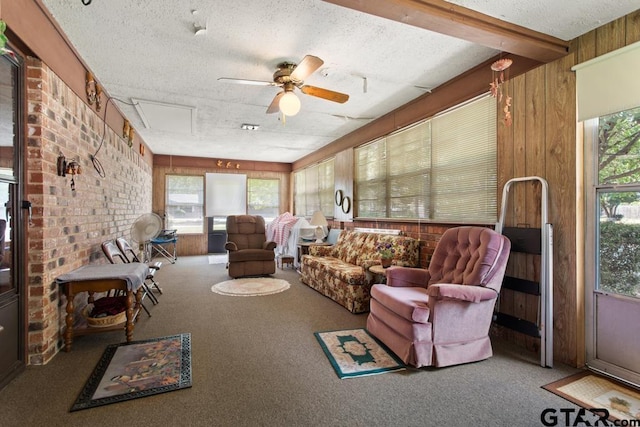 21187 Kristen Dr, Chandler, TX 75758 - sunroom / solarium featuring ceiling fan, carpet floors, a textured ceiling, and wood walls
