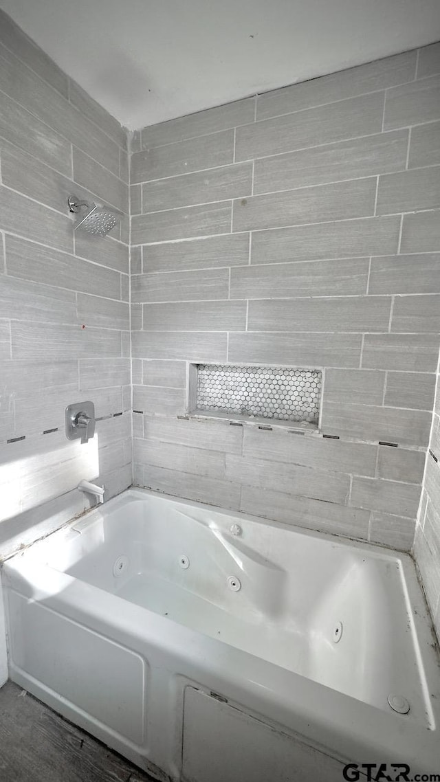 bathroom featuring a washtub