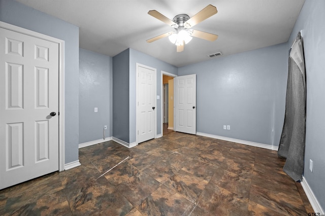 unfurnished bedroom featuring ceiling fan