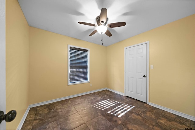 unfurnished room with ceiling fan