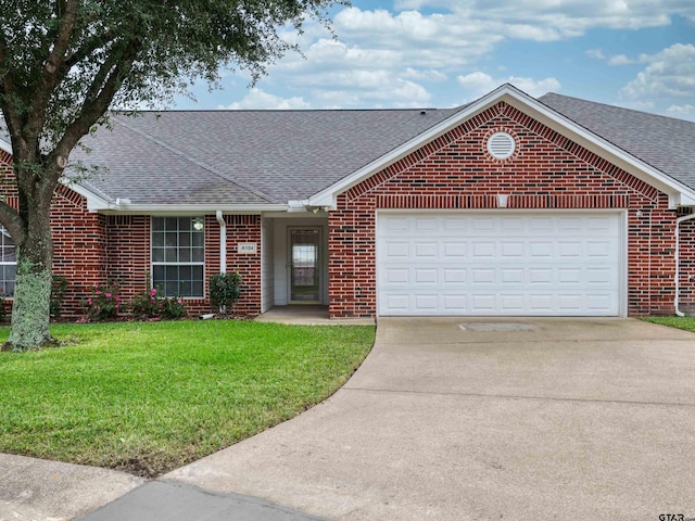 ranch-style house with a garage and a front yard