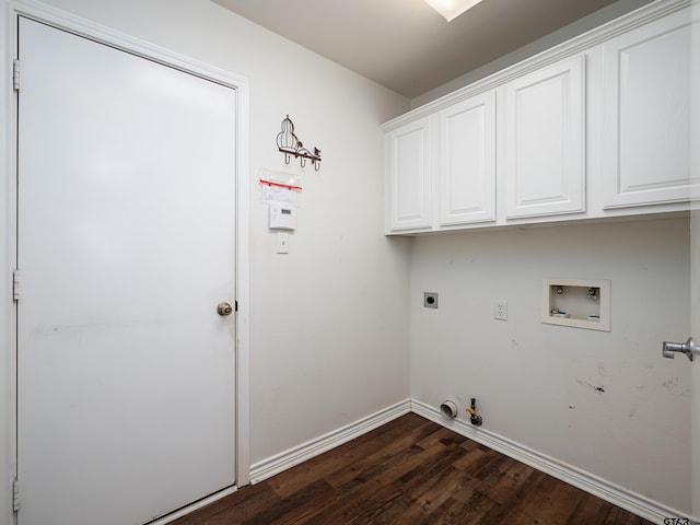 clothes washing area featuring hookup for an electric dryer, washer hookup, hookup for a gas dryer, dark hardwood / wood-style floors, and cabinets