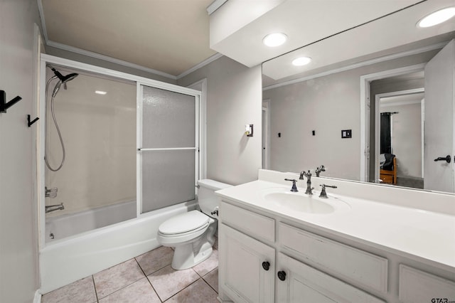 full bathroom featuring toilet, tile patterned flooring, washtub / shower combination, vanity, and crown molding