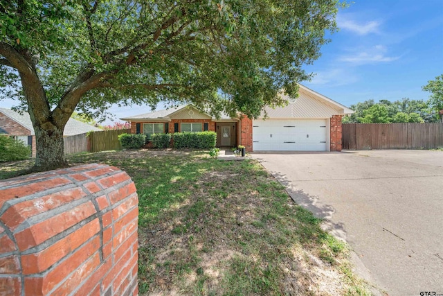 single story home featuring a garage