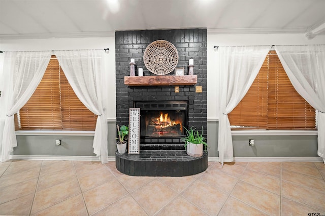 unfurnished living room featuring a brick fireplace, tile patterned flooring, and ornamental molding