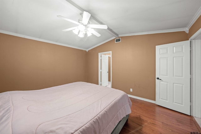 bedroom featuring hardwood / wood-style flooring, lofted ceiling with beams, ceiling fan, and crown molding