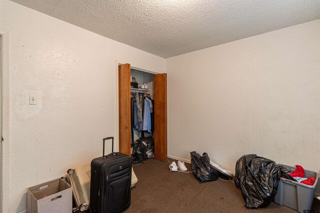 2114 Martin Luther King Blvd, Palestine, TX 75803 - unfurnished bedroom featuring carpet and a textured ceiling