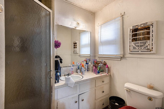2114 Martin Luther King Blvd, Palestine, TX 75803 - full bath with vanity, a stall shower, toilet, and a textured ceiling