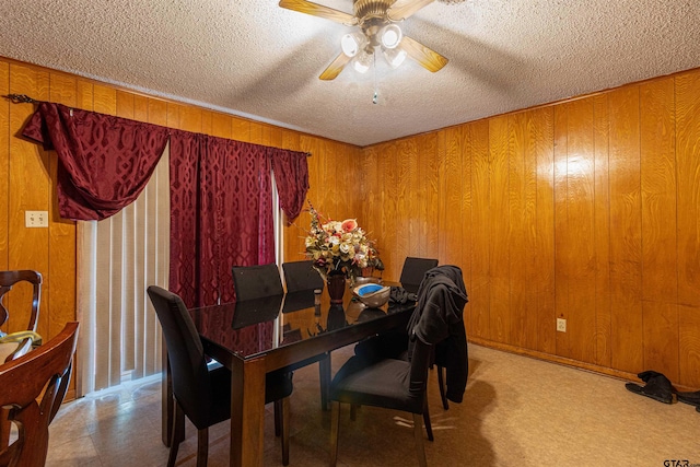 2114 Martin Luther King Blvd, Palestine, TX 75803 - dining room with a ceiling fan, wood walls, and a textured ceiling