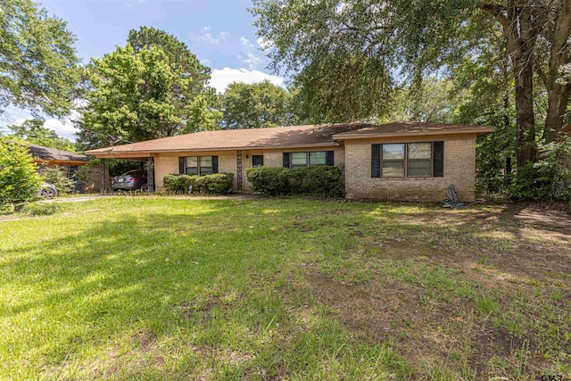 2114 Martin Luther King Blvd, Palestine, TX 75803 - single story home with brick siding, an attached carport, and a front yard