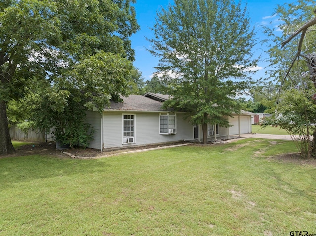 view of front facade with a garage and a front lawn