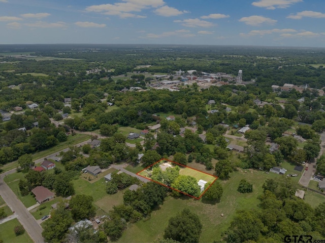 drone / aerial view featuring a view of trees