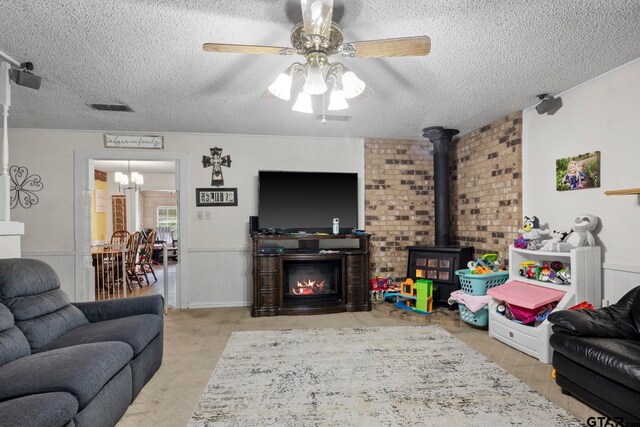 living room featuring a textured ceiling and ceiling fan