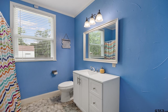 full bathroom featuring vanity, ornamental molding, baseboards, and toilet