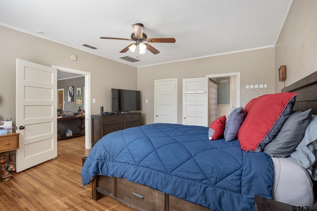 bedroom featuring ceiling fan, visible vents, ornamental molding, and light wood-style floors