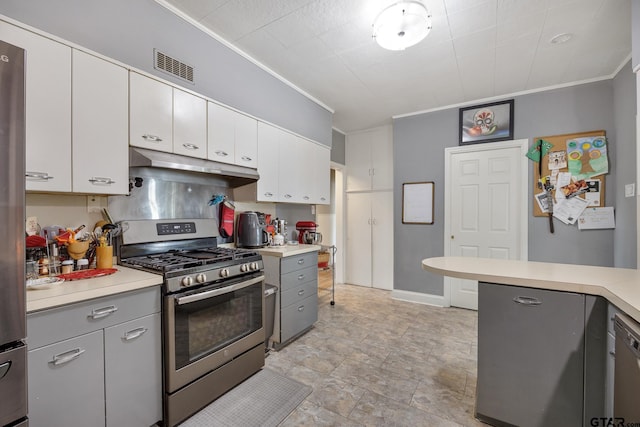 kitchen with visible vents, crown molding, stainless steel range with gas stovetop, light countertops, and under cabinet range hood