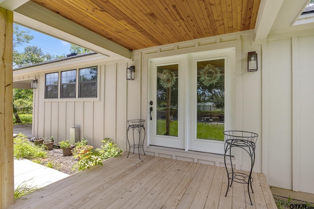 702 W Paschal St, Troup, TX 75789 - view of exterior entry featuring board and batten siding and a deck