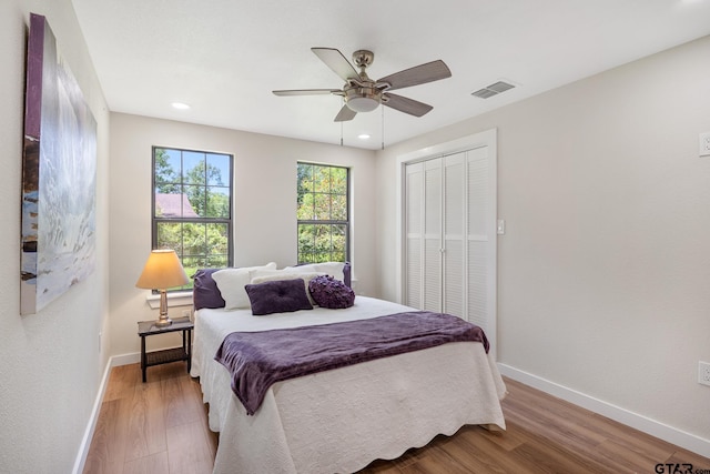702 W Paschal St, Troup, TX 75789 - bedroom with wood finished floors, recessed lighting, a closet, and a ceiling fan