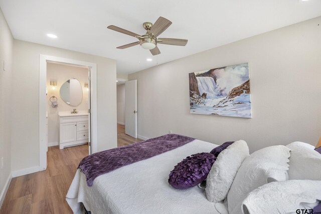 702 W Paschal St, Troup, TX 75789 - bedroom with light wood-style floors, recessed lighting, connected bathroom, and ceiling fan