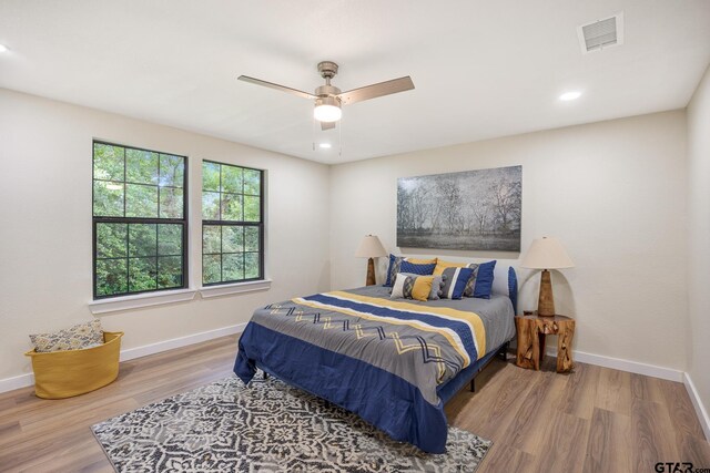 702 W Paschal St, Troup, TX 75789 - bedroom featuring wood finished floors, recessed lighting, and a ceiling fan
